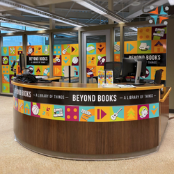 Library of Things desk at Library - Beyond Books on desk with colorful images